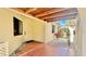 Inviting entryway with terracotta tile flooring and landscaping at 1640 Atares Dr # 31, Punta Gorda, FL 33950