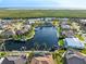 An aerial view of waterfront homes nestled along a scenic canal, showcasing the community's layout and water access at 1701 Casey Key Dr, Punta Gorda, FL 33950