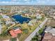 Aerial view of a community with waterfront homes and canals, showcasing the beautiful landscaping at 1701 Casey Key Dr, Punta Gorda, FL 33950