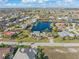 Stunning aerial view of a community with waterfront homes and canals, showcasing the beautiful landscaping at 1701 Casey Key Dr, Punta Gorda, FL 33950