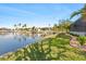 Beautiful backyard with mature landscaping overlooking the canal, enhancing privacy and tranquility at 1701 Casey Key Dr, Punta Gorda, FL 33950