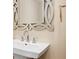 Bathroom with modern sink, decorative mirror and sleek chrome faucet at 1701 Casey Key Dr, Punta Gorda, FL 33950