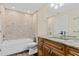 Bathroom featuring marble counters and tiled bathtub at 1701 Casey Key Dr, Punta Gorda, FL 33950