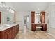 Luxurious bathroom showcasing a double vanity, elegant fixtures, and spa-like ambiance for ultimate relaxation at 1701 Casey Key Dr, Punta Gorda, FL 33950