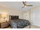 Cozy bedroom showcasing a comfortable bed with stylish bedding and a matching nightstand at 1701 Casey Key Dr, Punta Gorda, FL 33950