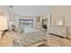 Bedroom featuring waterfront views from sliding glass doors and windows at 1701 Casey Key Dr, Punta Gorda, FL 33950