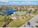 Beautiful home with a green roof, lush landscaping, and a lovely water view from its frontage at 1701 Casey Key Dr, Punta Gorda, FL 33950