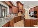 Well-appointed kitchen boasts ample storage, sleek appliances, and stylish countertops and backsplash at 1701 Casey Key Dr, Punta Gorda, FL 33950