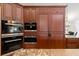 Modern kitchen with stainless steel appliances and wood cabinets at 1701 Casey Key Dr, Punta Gorda, FL 33950