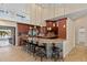 Spacious kitchen features a large island with seating and seamless indoor-outdoor living at 1701 Casey Key Dr, Punta Gorda, FL 33950