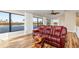 Upper-level living room with comfortable seating, a ceiling fan, and a view of the waterway at 1701 Casey Key Dr, Punta Gorda, FL 33950