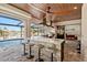 An outdoor kitchen and bar, perfect for poolside entertaining at 1701 Casey Key Dr, Punta Gorda, FL 33950