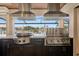 Outdoor kitchen boasts stainless steel appliances and a scenic waterfront view at 1701 Casey Key Dr, Punta Gorda, FL 33950
