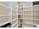 Large pantry with multiple white shelves, great for organization and storage at 1701 Casey Key Dr, Punta Gorda, FL 33950