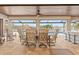 Covered patio with dining area and waterfront views at 1701 Casey Key Dr, Punta Gorda, FL 33950
