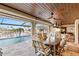 Covered patio with dining area and views of the pool and waterfront at 1701 Casey Key Dr, Punta Gorda, FL 33950