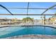 Screened-in pool with beautiful waterfront views of the canal at 1701 Casey Key Dr, Punta Gorda, FL 33950