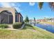 Canal-front view of villa with lush landscaping and gazebo at 1890 Deborah Dr # 14, Punta Gorda, FL 33950