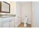 Small half bathroom with granite countertop and single vanity at 1890 Deborah Dr # 14, Punta Gorda, FL 33950