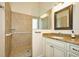 Walk-in shower with grab bars and a single vanity with granite countertop at 1890 Deborah Dr # 14, Punta Gorda, FL 33950