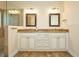 Double vanity bathroom with granite countertops and a large shower at 1890 Deborah Dr # 14, Punta Gorda, FL 33950