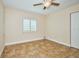Simple bedroom with tile floors, window with shutters, and a ceiling fan at 1890 Deborah Dr # 14, Punta Gorda, FL 33950