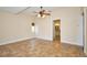 Bright bedroom with tile floors, ceiling fan, and an ensuite bathroom at 1890 Deborah Dr # 14, Punta Gorda, FL 33950