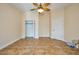 Bedroom with tile floors, ceiling fan and a double door closet at 1890 Deborah Dr # 14, Punta Gorda, FL 33950