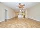 Open living room with tile flooring and ceiling fan at 1890 Deborah Dr # 14, Punta Gorda, FL 33950