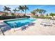 Relaxing community pool with lounge chairs and a clear blue water at 1890 Deborah Dr # 14, Punta Gorda, FL 33950