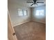 Spacious bedroom with neutral carpeting and ceiling fan at 18938 Ayrshire Cir, Port Charlotte, FL 33948