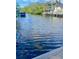 Peaceful view of a canal with boats and lush vegetation at 18938 Ayrshire Cir, Port Charlotte, FL 33948