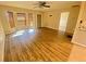 Bright living room featuring wood-look flooring and bay windows at 18938 Ayrshire Cir, Port Charlotte, FL 33948