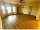 Living room with wood-look flooring and lots of natural light at 18938 Ayrshire Cir, Port Charlotte, FL 33948