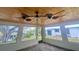 Screened porch with water views and ceiling fan at 18938 Ayrshire Cir, Port Charlotte, FL 33948