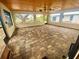 Spacious screened porch with tile flooring and wood ceiling at 18938 Ayrshire Cir, Port Charlotte, FL 33948