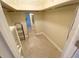 Spacious walk-in closet with shelving and hanging rod at 18938 Ayrshire Cir, Port Charlotte, FL 33948