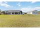 Large, open backyard with a screened-in pool and detached garage at 2154 Azure Rd, North Port, FL 34286