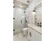 Modern bathroom featuring a glass shower, marble tile, updated vanity, and sleek black fixtures at 2154 Azure Rd, North Port, FL 34286