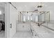 Bathroom boasts double vanity with marble countertop and modern lighting at 2154 Azure Rd, North Port, FL 34286