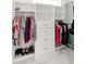 Walk-in closet boasts custom shelving, drawers, and ample storage space at 2154 Azure Rd, North Port, FL 34286