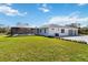 Exterior view of the home with a screened-in pool and detached garage at 2154 Azure Rd, North Port, FL 34286