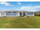 Beautiful home featuring a spacious lawn and neutral color palette at 2154 Azure Rd, North Port, FL 34286