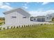 View of a two-car attached garage with brick driveway and landscape at 2154 Azure Rd, North Port, FL 34286