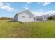 View of the detached garage from the side of the house at 2154 Azure Rd, North Port, FL 34286