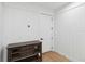 Hallway features stylish wood paneling, modern fixtures, and a view into another room at 2154 Azure Rd, North Port, FL 34286