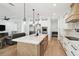 Modern kitchen with large island, stainless steel appliances and an open floor plan perfect for entertaining guests at 2154 Azure Rd, North Port, FL 34286