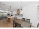 Bright modern kitchen offers luxury with stainless steel appliances, a large island, and custom cabinets at 2154 Azure Rd, North Port, FL 34286