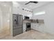 Stylish kitchenette with stainless steel appliances, white cabinetry, and modern design at 2154 Azure Rd, North Port, FL 34286
