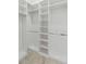 Spacious walk-in closet with custom shelving and ample storage space at 2154 Azure Rd, North Port, FL 34286